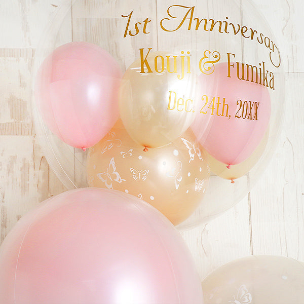 可憐な蝶と優しい色で祝うセレモニーアレンジ